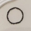 Black hematite beaded anklet bracelet, shiny oval and round stone beads minimalist jewelry style. - Black Glossy Oval Bead Style (F24-005)