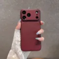 Detailed shot of wine red leather texture phone case held in hand, showing camera protection. - Wine Red with V-Pattern / iPhone 18 Pro Max