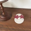 Close-up detail of cute red and white polka dot star phone grip holder on display stand. - iPhone 17/18 / Dual Star Magnetic (Single Stand)