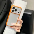 Detail view of frosted matte phone case with large camera window and orange frame design. - Orange / iPhone17