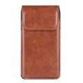 Close up detail of brown leather phone holster, vertical belt pouch with magnetic closure. - Universal Within 154mm Long / Tan