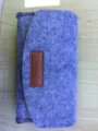 Detailed view of the grey felt phone pouch featuring a brown leather label and neat stitching. - 160*90*38mm / Light Blue