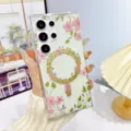 Clear magnetic floral phone case detail showing exquisite pink flower pattern and gold ring. - Style C3 / Galaxy S26