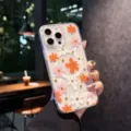 Clear magnetic phone case with cute colorful flower patterns and drop-proof design for iPhone. - Orange / iPhone17
