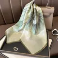 Elegant green lotus print silk square scarf, stylish botanical neckerchief for women. - Gold-rimmed Green Lotus