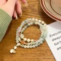 Exquisite multi-layer Tianshan jade bracelet with pearls and delicate gourd pendant. - Tianshan Green Jade & Gourd