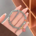 Exquisite 6mm jade bead bracelet featuring a cute pink peach pendant and delicate golden spacer. - Honey Peach Style