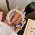 Retro glazed glass bead bracelet with colorful crystal stones and a cute charm for women. - White