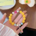 Exquisite Chinese style lotus bracelet featuring colorful beaded design with sweet aesthetic. - Yellow Agate