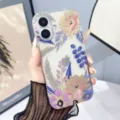 Detail shot of clear floral phone case with stylish colorful pattern and drop protection for iPhone. - Z3 / iPhone17
