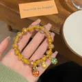 Glazed rose beaded bracelet with gold beast pendant, sweet princess style jewelry variant. - Rose Orange Yellow