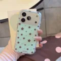 Detailed close-up shot of the mint green phone case featuring cute brown stars pattern. - Single Case (iPhone 17 Pro Max) / Mint Green Base Brown Stars Polka Dots