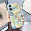 Detailed close-up of a clear phone case featuring a charming blue and yellow floral pattern. - Z2 / iPhone17