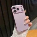 Close-up detail of glitter phone case with large camera window protection and pink finish. - Purple