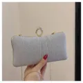 Silver glitter evening clutch bag with rhinestone ring clasp and gold chain strap detail. - Silver