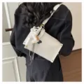 Women white leather crossbody bag with wide strap and cute horse charm fashion handbag. - White