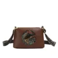 Retro brown PU leather shoulder bag with ethnic embossed elephant design and strap. - Brown