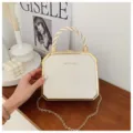 Chic white box handbag featuring a stylish twisted handle and elegant gold chain strap for women. - White