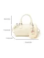 White leather bowling bag detail showing dimensions, handle and cute fluffy plush doll keychain. - White With Pendant