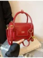 Stylish red retro PU leather handbag with cherry charm, chic shoulder crossbody bag for women. - Burgundy