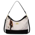 Black and white quilted hobo shoulder bag with wooden bead charm and turn lock closure. - Off White