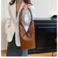 Retro glossy brown shoulder bag for women, stylish tote bag with metal grommet and bow details. - Brown