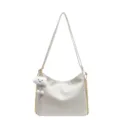 White soft leather slouchy shoulder bag with chic gold chain strap and cute cloud pendant. - White