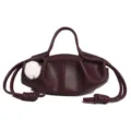 Burgundy leather pleated drawstring handbag with white fluff charm, stylish dumpling bag. - Burgundy