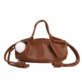 Brown napa leather dumpling handbag with drawstring knots and fluffy white pompom charm. - Brown
