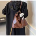 Brown soft leather slouchy shoulder bag dumpling bag with cute plush cloud keychain variant - Coffee With Pendant