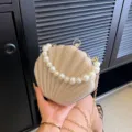 Gold glitter shell evening bag with elegant pearl handle and stylish chain strap for women. - One Size / Gold