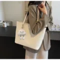 Detailed view of women's casual large-capacity tote bag featuring a cute plush cloud pendant. - Single Bag / Off White
