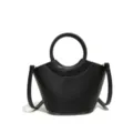 Black leather bucket handbag with round top handle and crossbody strap for women fashion. - Black
