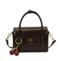 Vintage glossy brown small square handbag with cherry charm, chic retro shoulder cross body bag. - Black