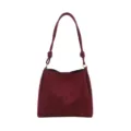 Close-up of the burgundy suede shoulder bag featuring a stylish knotted strap detail. - Red