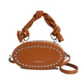 Brown oval studded crossbody bag with stylish twisted handle and unique leather finish. - Brown