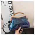 Retro gradient snakeskin pattern handbag with metal kiss-lock closure and elegant top handle. - Blue