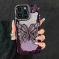 Detailed view of the sparkling purple rhinestone butterfly phone case with stunning gradient glitter. - Purple with Glitter Paper / iPhone 17