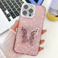Pink marbled iPhone case detail view featuring a glossy 3D butterfly stand and glitter camera lens. - 13 / Shell Pattern Stand Style (With Lens Film) / Pink