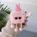 Close-up of cute pink plush AirPods protective case with sunglasses and knitted hat detail. - Airpods 1/2 Universal / Pink Character
