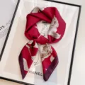 Red silk scarf with elegant floral print, luxurious smooth texture for women's spring fashion. - Red Rose