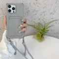 Grijze siliconen telefoonhoesje met kaartvak en lanyard, gedetailleerd overzicht hoeken. - Grijs + koord