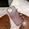 Close-up view of a frosted translucent soft phone case with minimalist vertical stripes detail. - 13pro / Frosted Black