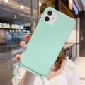 Gedetailleerd overzicht van mintgroene siliconen telefoonhoesje met koord voor iPhone. - Munt Groen / iPhone16promax