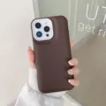 Close-up of brown liquid silicone phone case with white camera protection frame, detail view. - Dark Coffee