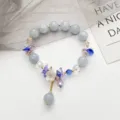 Bracelet de perles en cristal frais avec pendentif fleur et élégant bijou Hanfu pour femmes. - Fleur en Pierre Bleue / Gris clair