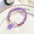 Detailed shot of sparkling purple crystal beaded bracelet with cute fox pendant for Hanfu style. - Glazed Fox / Amethyst Purple