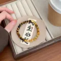 Natural yellow tiger eye stone bracelet detail, exquisite gemstone beading with gold charm. - Yellow Tiger Eye Peace Lock
