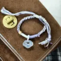 Tibetan style braided adjustable bracelet with jade ruyi lock pendant, purple and white cord. - White Agate Auspicious Clouds