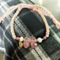 Chic braided bracelet featuring a sweet pink crystal bow, delicate pearls, and stylish charms. - Strawberry Crystal Bowknot
